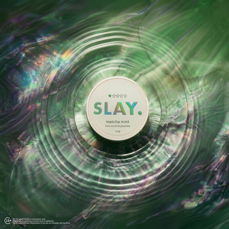SLAY Matcha Mint nicotine pouch placed at the centre of shimmering green ripples with an iridescent liquid-style background.
